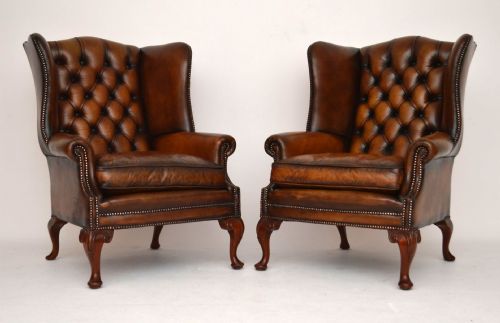 Pair of Antique Deep Buttoned Leather Wing Armchairs
