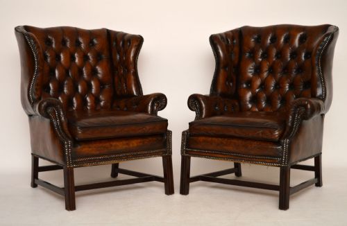 Pair of Antique Deep Buttoned Leather Wing Armchairs