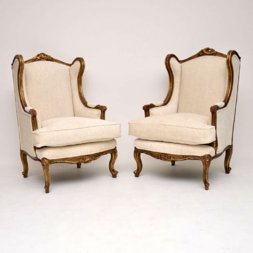 Pair of Antique French Gilt Wood Wing Back Armchairs