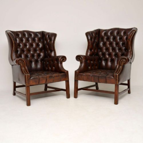 Pair of Antique Deep Buttoned Leather Wing Back Armchairs