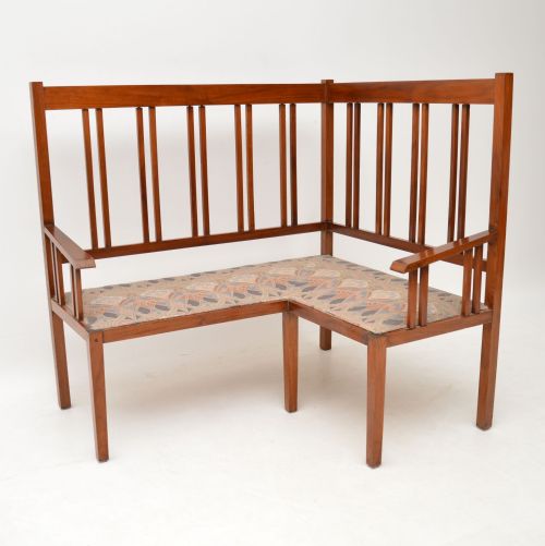 Antique Arts & Crafts Solid Walnut Corner Settee from Liberty of London