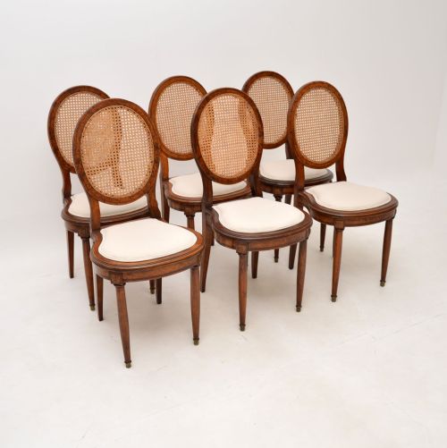 Set of Six Antique French Walnut Cane Back Dining Chairs
