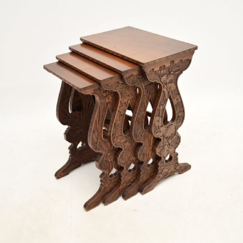 Antique Art Nouveau Carved Mahogany Nest of Four Tables
