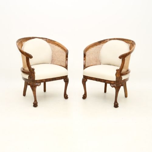 Pair of Antique Caned Walnut Bergère Armchairs
