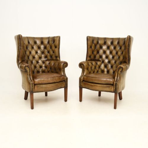 Pair of Antique Leather Barrel Back Wing Armchairs
