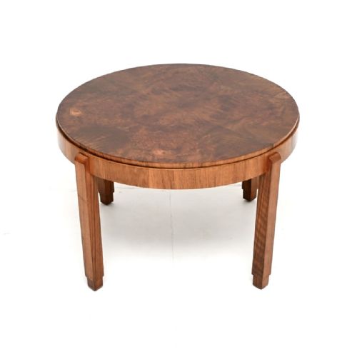 fig 1. A circular Art Deco coffee table crafted from figured burr walnut veneer with four straight legs and a deep apron.