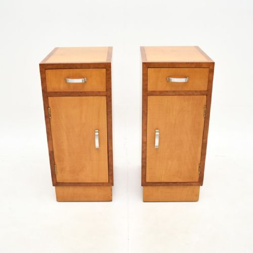 fig 1. A pair of Art Deco bedside cabinets constructed from light-coloured satinwood with contrasting walnut crossbanding and silver metal handles.