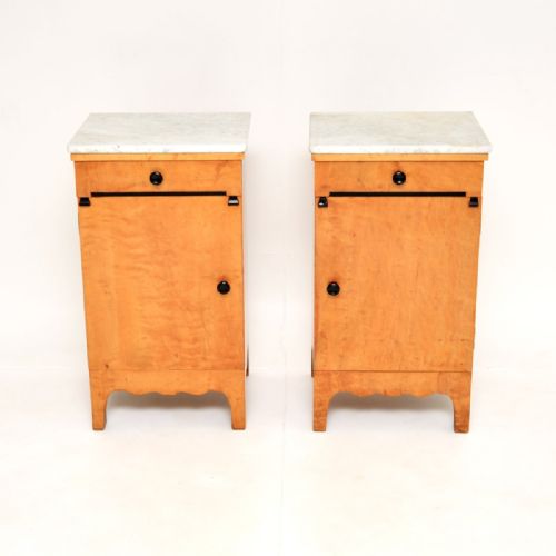 fig 1. A matching pair of antique Swedish satin birch bedside cabinets with white marble tops, single drawers, and lower cupboard doors.