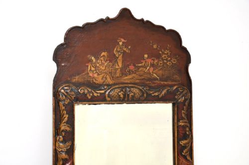 fig 1. An antique Georgian wall mirror featuring a shaped cresting top decorated with hand-painted red lacquer and gold Chinoiserie figures.