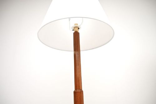 fig 1. A pair of Art Deco walnut floor lamps featuring octagonal stepped bases, slender faceted stems, integrated glass trays, and white shades.