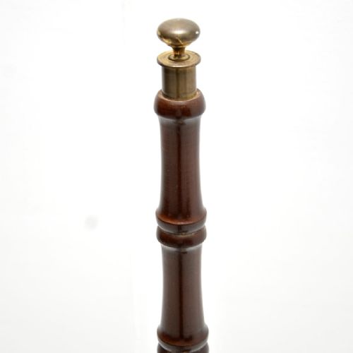 fig 2. Antique spiral mahogany library steps featuring four gold-tooled leather treads and a central turned support pole topped with a brass finial.