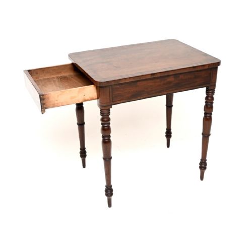 fig 1. A rectangular Georgian mahogany side table featuring a polished wood surface resting on four slim turned legs.