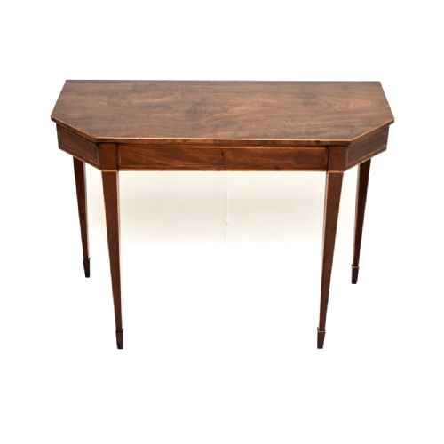 fig 1. A Georgian mahogany console table featuring canted corners, boxwood stringing, and tapered square legs.