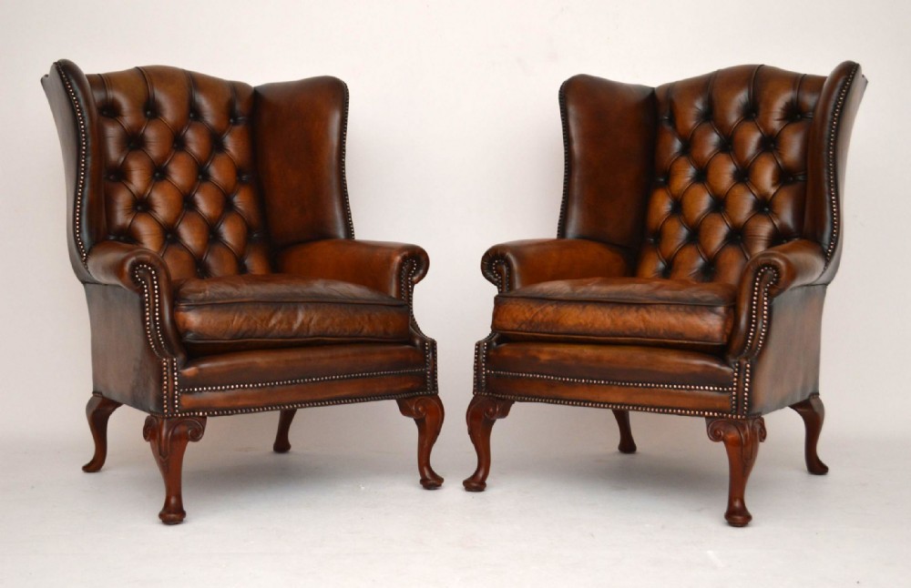 Pair of Antique Deep Buttoned Leather Wing Armchairs