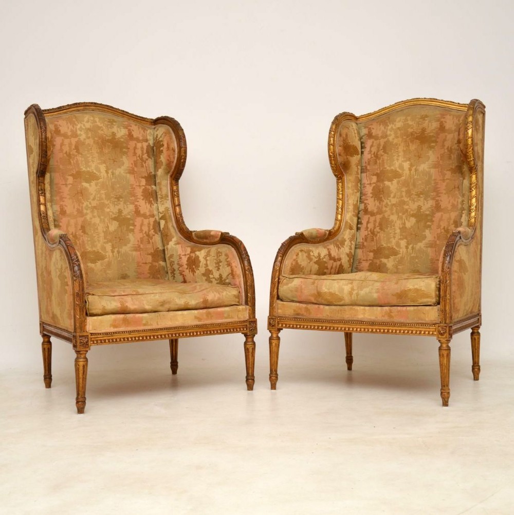 Pair of Antique Gilt Wood Wing Back Armchairs