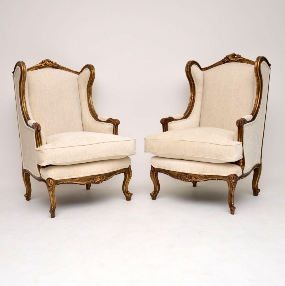 Pair of Antique French Gilt Wood Wing Back Armchairs