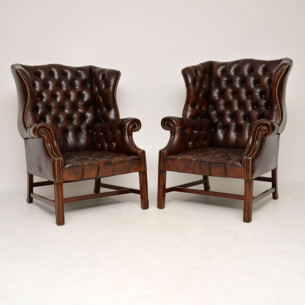 Pair of Antique Deep Buttoned Leather Wing Back Armchairs