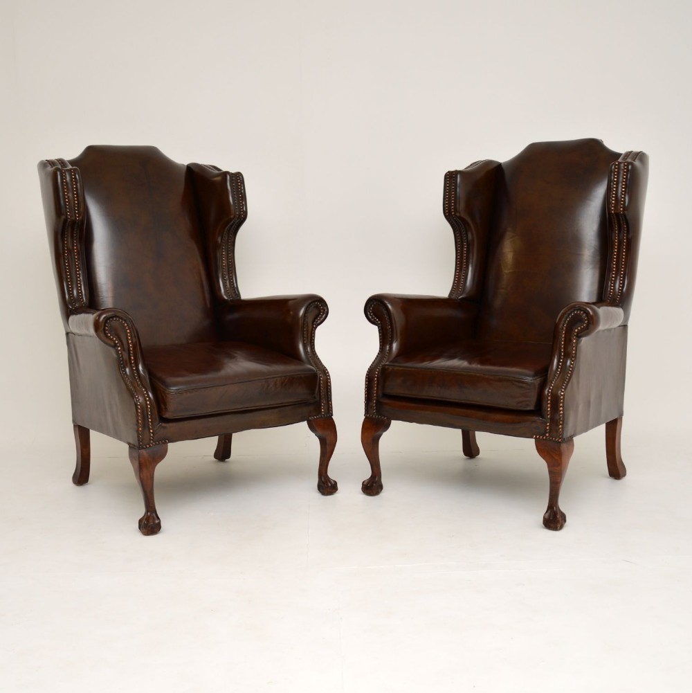 Pair of Antique Leather Wing Back Armchairs