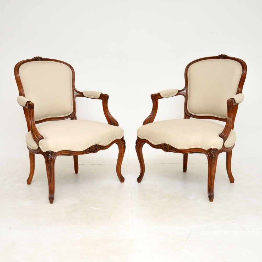 Pair of Antique French Walnut Salon Armchairs
