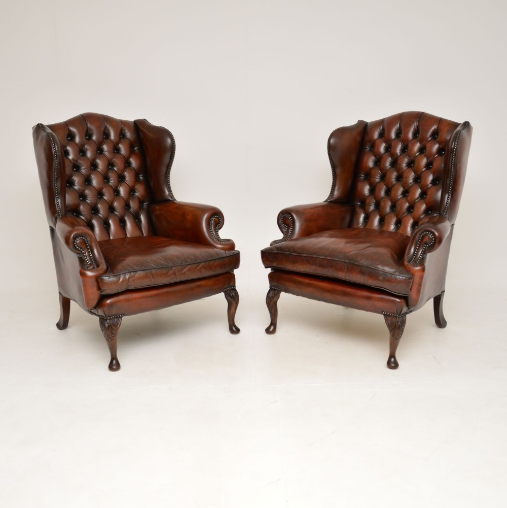 Pair of Antique Leather Wing Back Armchairs