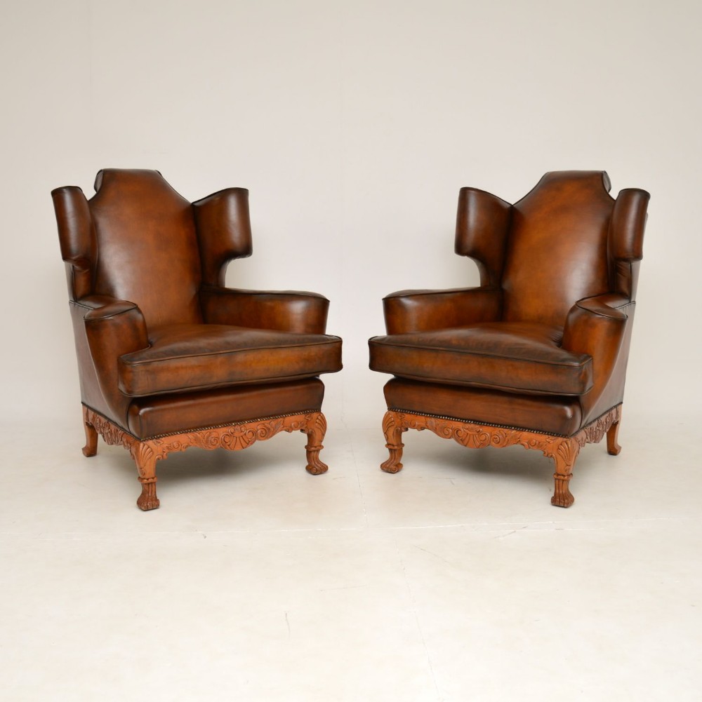 Pair of Antique Leather Wing Back Armchairs