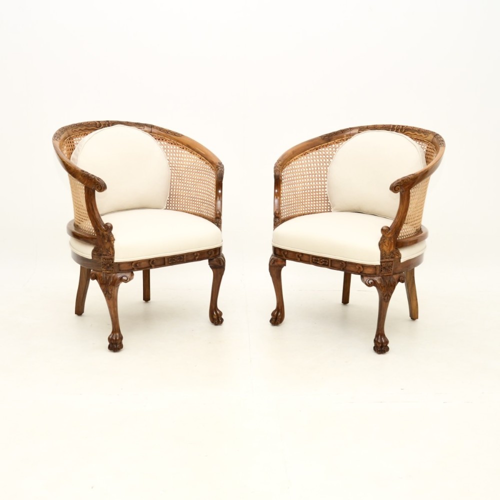 Pair of Antique Caned Walnut Bergère Armchairs
