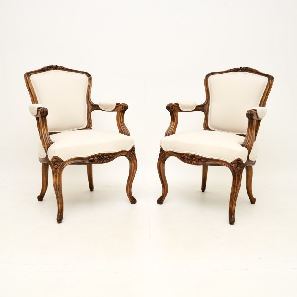Pair of Antique French Carved Walnut Salon Armchairs
