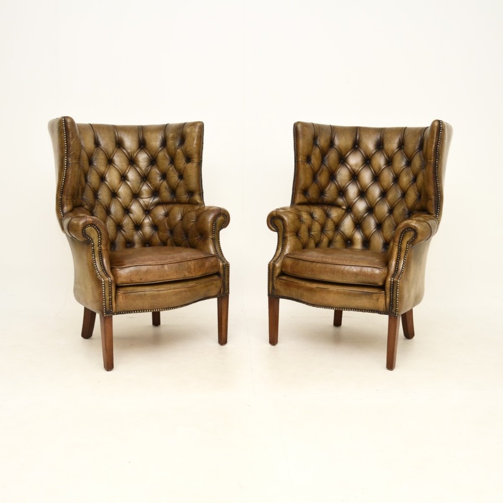 Pair of Antique Leather Barrel Back Wing Armchairs
