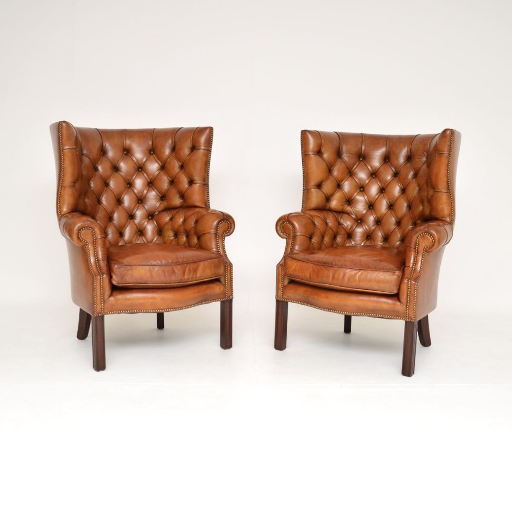 Pair of Antique Leather Barrel Back Wing Armchairs

