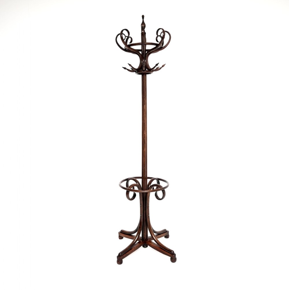 A tall dark wood bentwood coat stand featuring curved upper hooks, a central turned finial, a lower circular umbrella ring, and a four-footed splayed base.