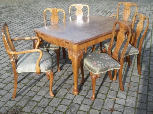 Antique £2450 Queen Anne Walnut Dining Suite of an Extending Eight Seat Table and Six Chairs