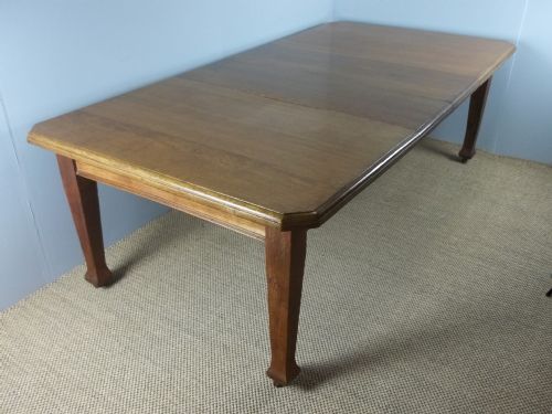 A Large Antique Oak Arts and Crafts Wind Out Extending Eight Ten Twelve Seat Dining Table. C.1900.