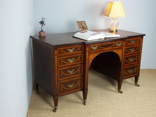 A  Fabulous Maples & Co Stamped Antique Mahogany Marquetry and Satinwood Inlaid Leather Topped  Breakfront Pedestal Desk . C.1895.