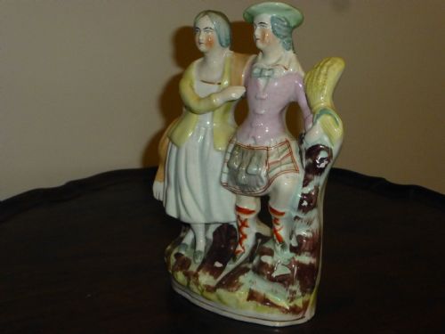 A STAFFORDSHIRE FLATBACK FIGURE OF SCOTTISH LAIRD AND HIS WIFE - ADDITIONAL PHOTO 2