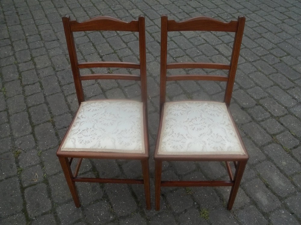 A pair of antique mahogany inlaid Edwardian side occasional bedroom upholstered hall chairs