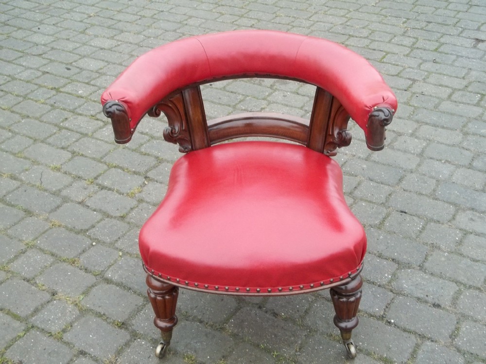 A fabulous regency Gillows design mahogany leather upholstered library reading captains desk armchair chair