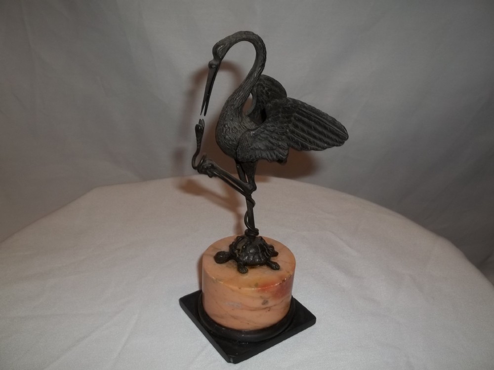 Antique 19th century bronze sculpture of a standing crane heron or stork bird a top a marble plinth