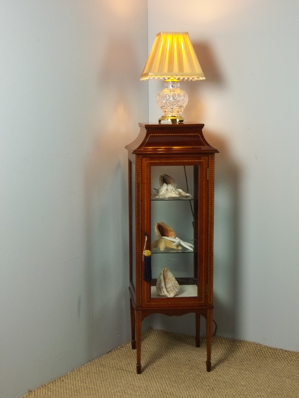A £995 Edwardian small mahogany inlaid standing upright square pencil pedestal bijouterie vitrine display curio collectors jewellery cabinet. 