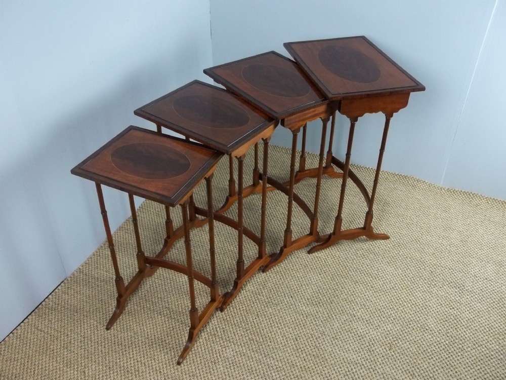 Antique set of Regency design Edwardian quartetto nest of four mahogany inlaid stacking occasional low lamp wine coffee tables table. C.1895.