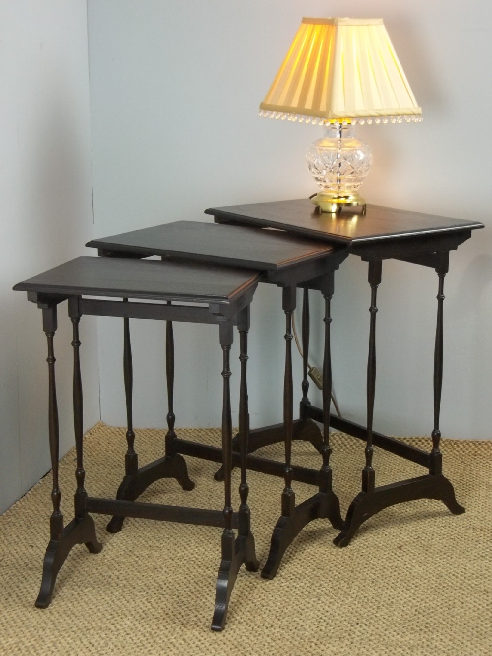A nest or trio of three antique Edwardian solid oak lamp stacking wine low small occasional sofa tables.C.1900.