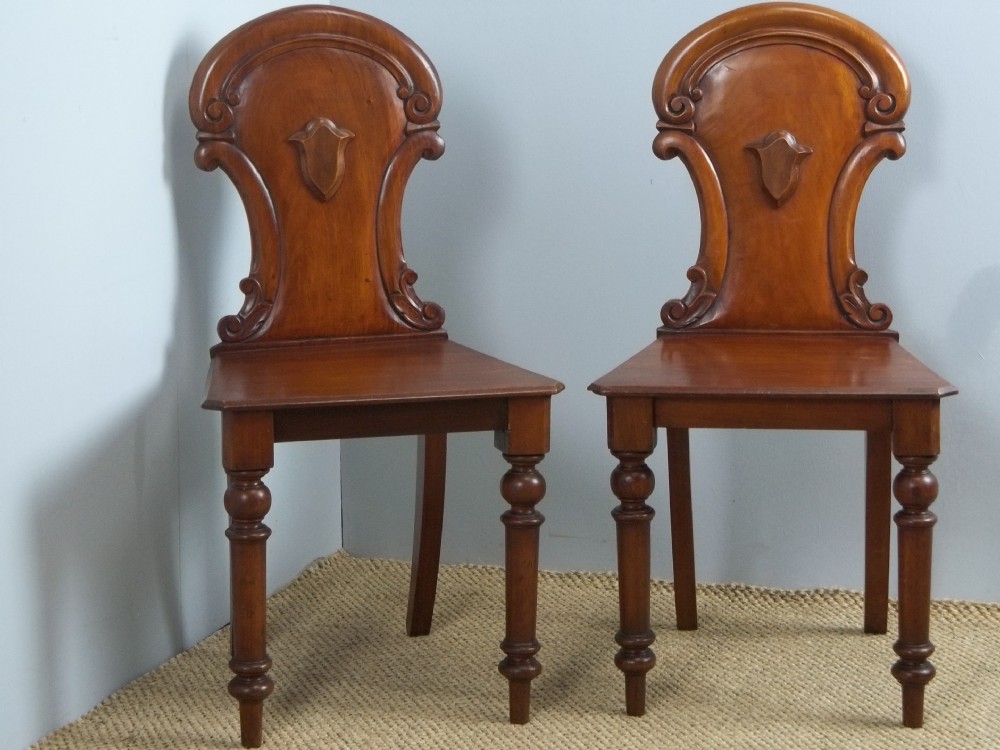 Antique pair of late Regency early Victorian mahogany hall side chairs. C.1840.