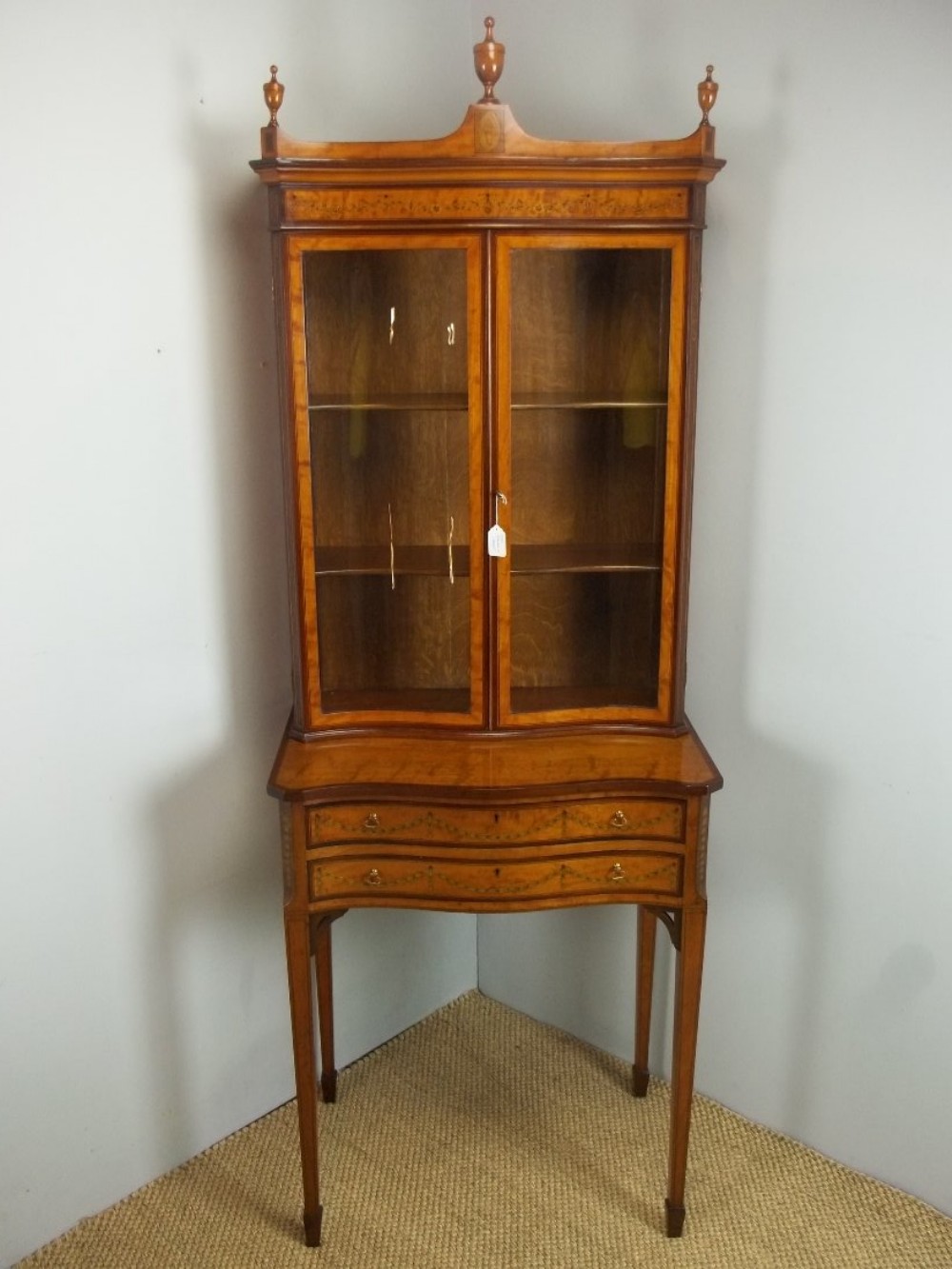 Antique small satinwood serpentine shaped marquetry inlaid bookcase display cabinet on stand 