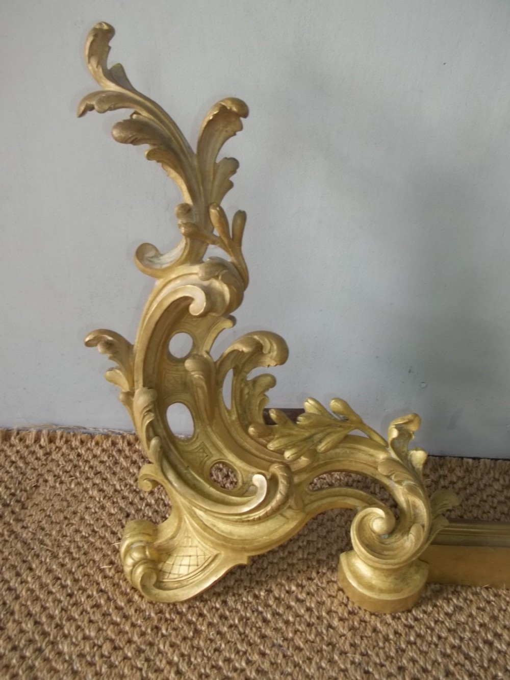 A 19th-century gilt bronze Rococo fireplace fender featuring adjustable scrolling acanthus leaf chenets at each end. View III