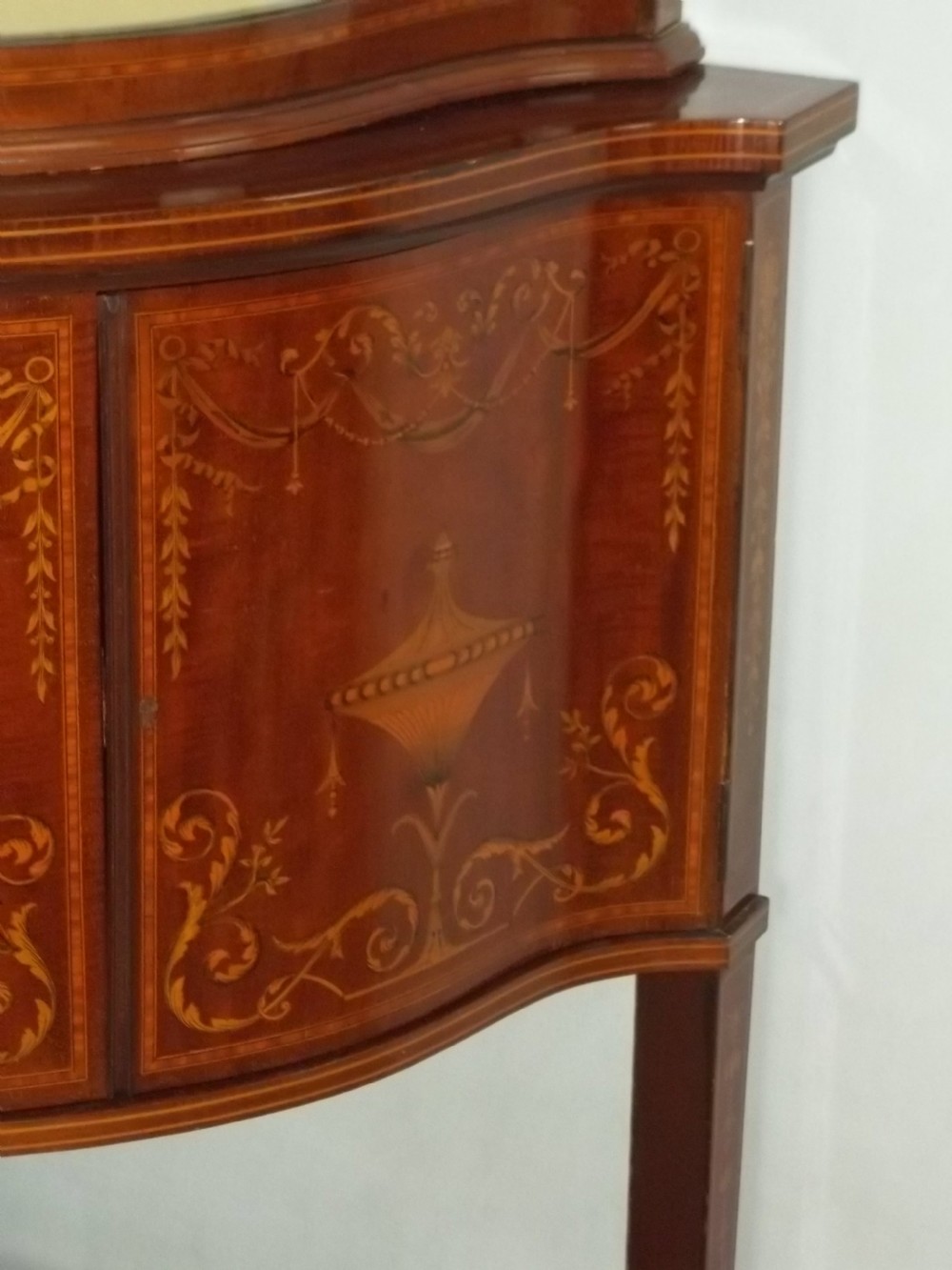 Antique Edwards and Roberts mahogany marquetry inlaid serpentine fronted corner double height standing corner display cabinet cupboard. C.1900 View III