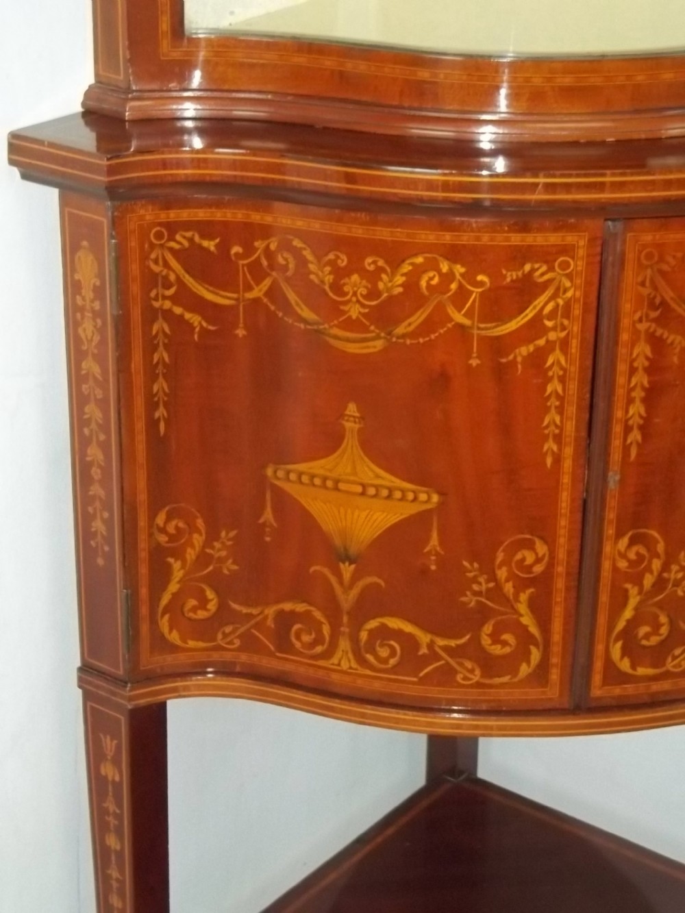 Antique Edwards and Roberts mahogany marquetry inlaid serpentine fronted corner double height standing corner display cabinet cupboard. C.1900 View IV