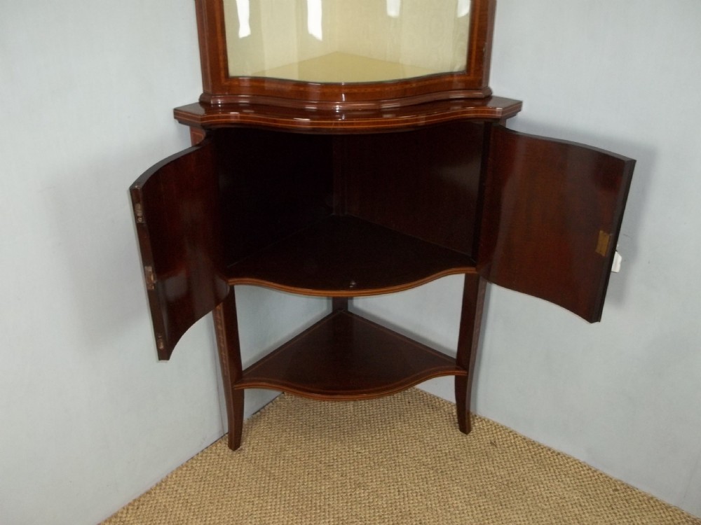 Antique Edwards and Roberts mahogany marquetry inlaid serpentine fronted corner double height standing corner display cabinet cupboard. C.1900 View VI
