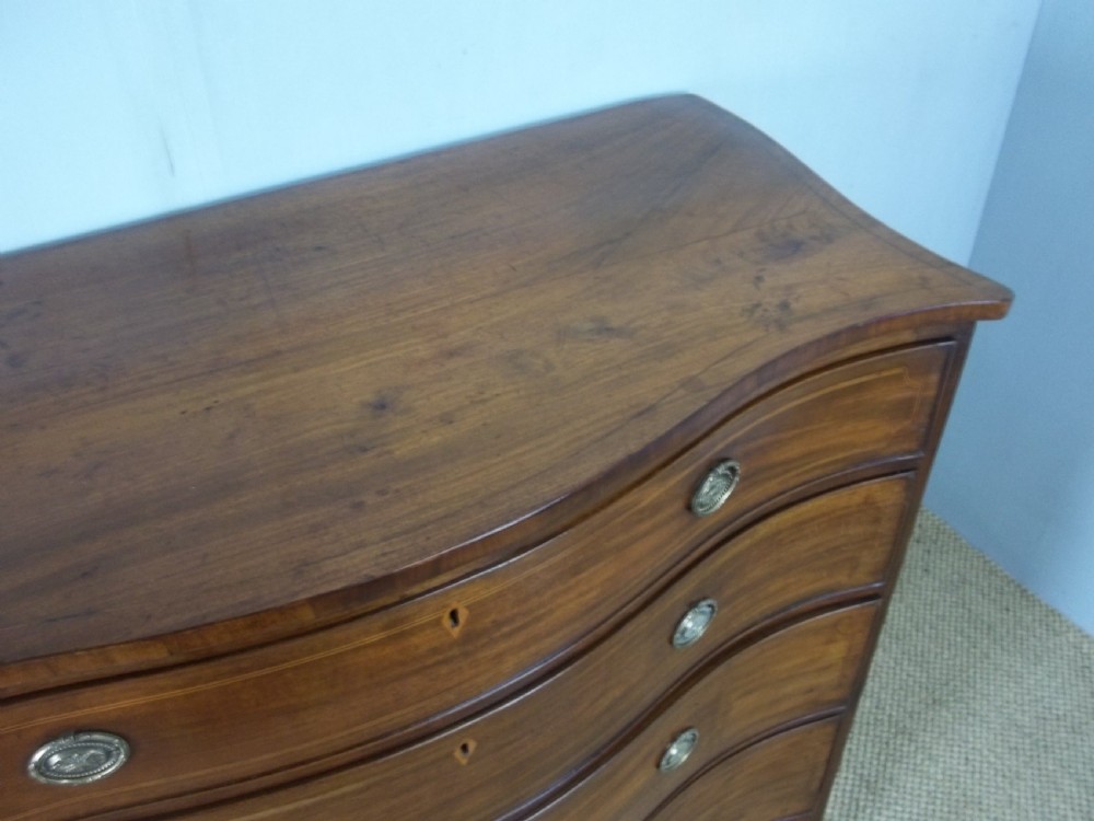 Antique 18th century George III Georgian mahogany inlaid serpentine shaped Hepplewhite  chest of drawers commode. C.1790  View II