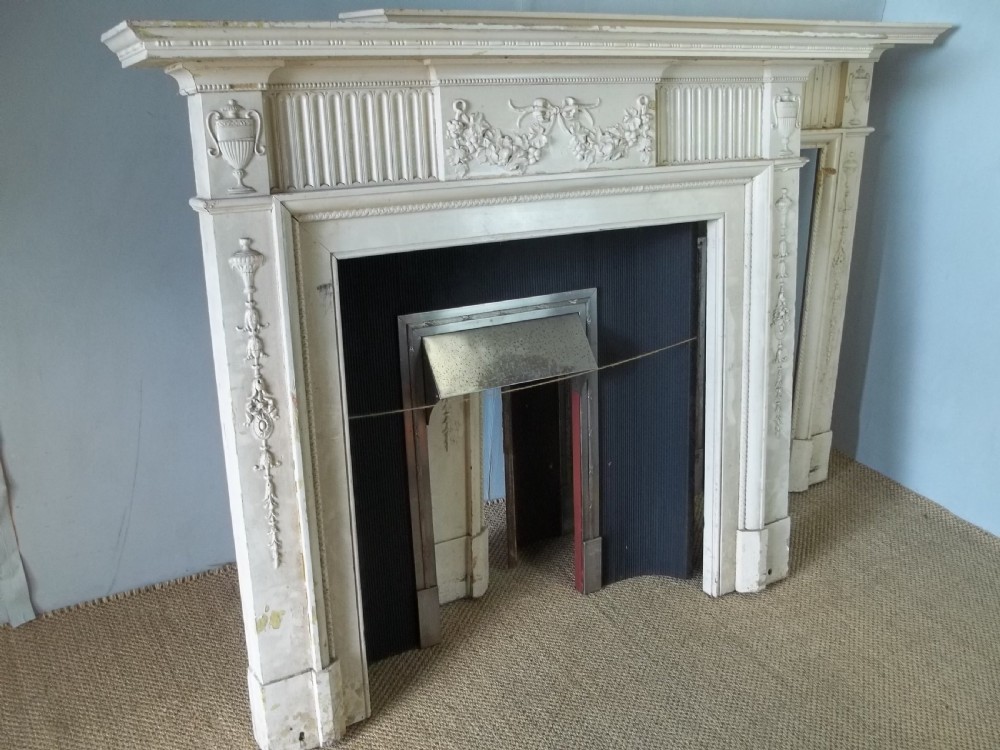 A rare pair of antique 19th century Regency Georgian Adam  style painted pine fire surround places and inserts