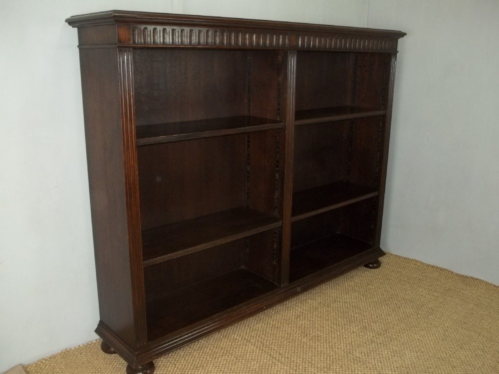 Solid oak bookshelf stamped Waring and Gillows late 19th/early 20th open set of adjustable bookshelves bookcase.C.1900 View II