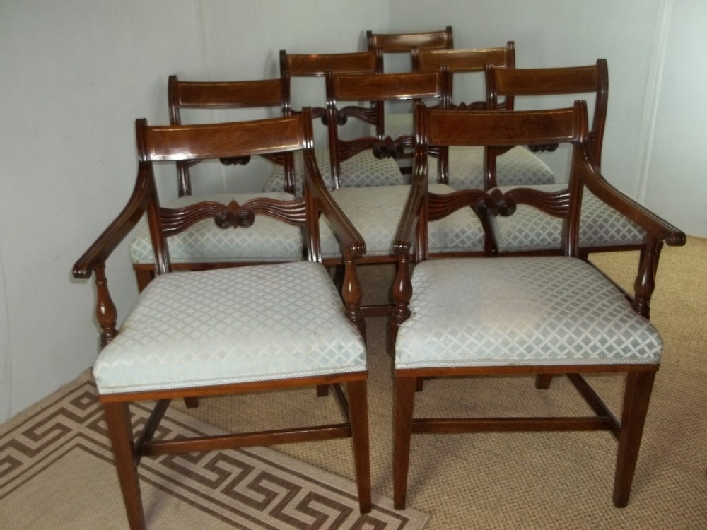 A superb antique set of Georgian 8 eight ( six plus two) Regency brass inlaid mahogany upholstered dining chairs